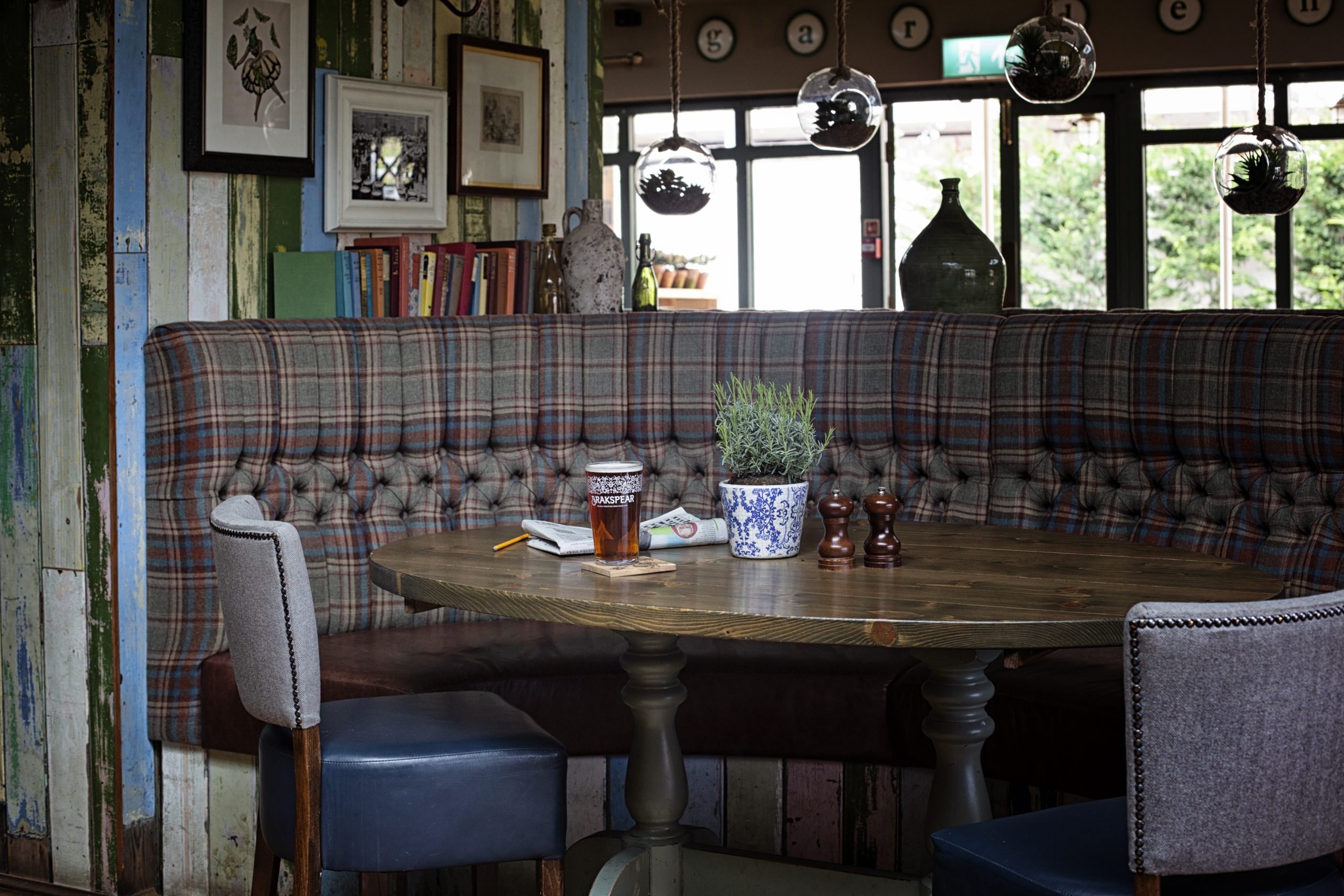 Cosy seating area with tartan banquette at The Dog & Duck, Wokingham